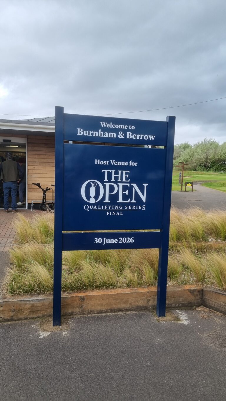 Blue sign reading: Welcome to Burnham & Berrow; The Open Qualifying Series Final, 30 June 2026.