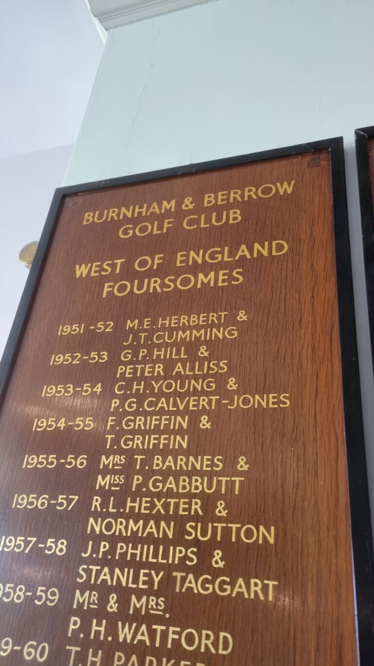 Wooden plaque with gold text listing past winners for Burnham & Berrow Golf Club, West of England Foursomes, including years and names.